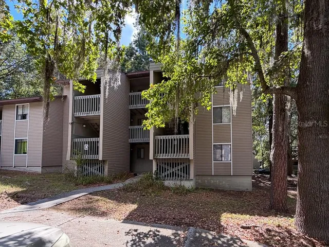 a house with a tree in front of it