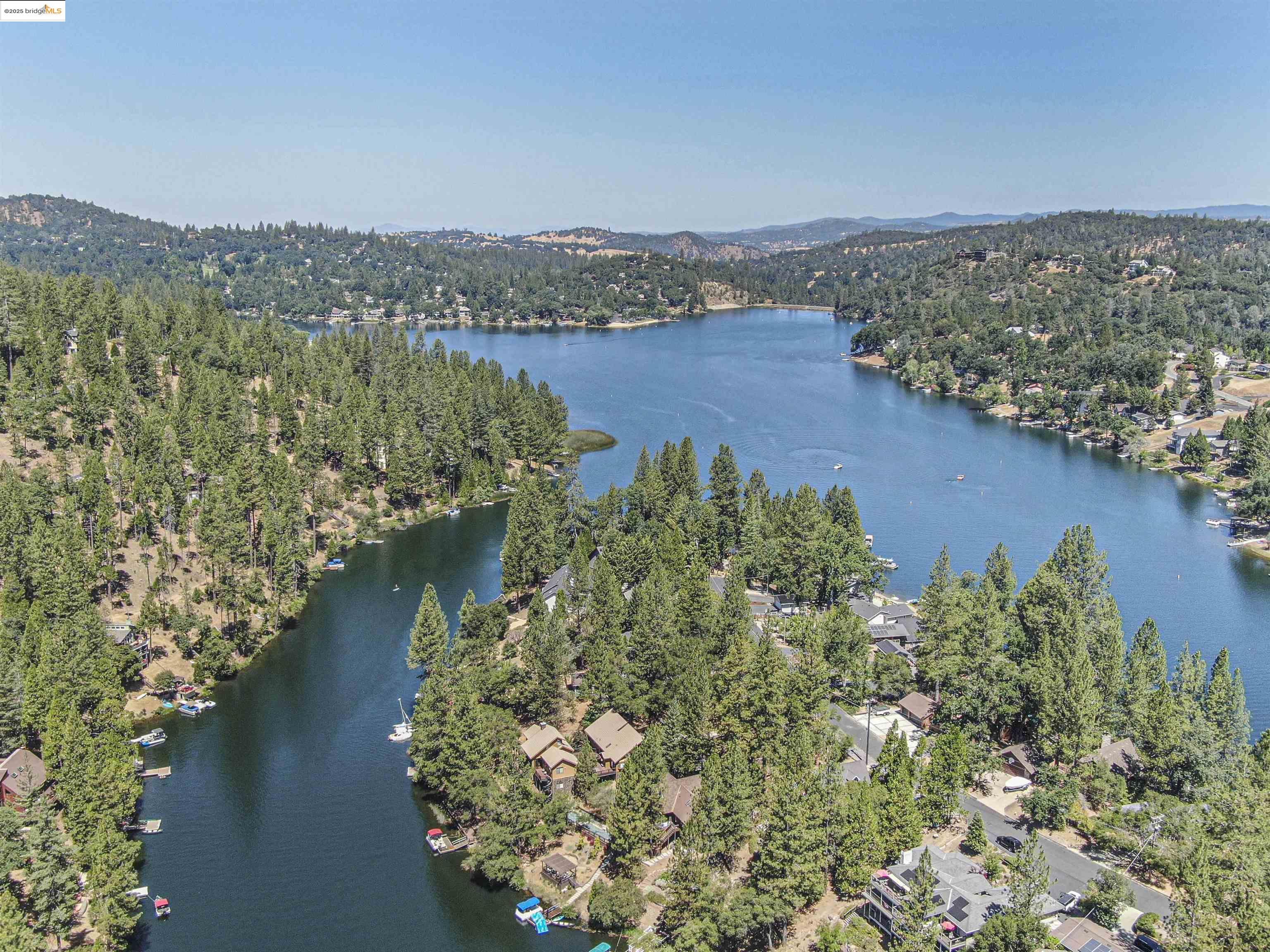 13-315 Ridgecrest Way Groveland, CA 95321 - Photo 7 of 9 Aerial view of property's location with a large body of water and a forest