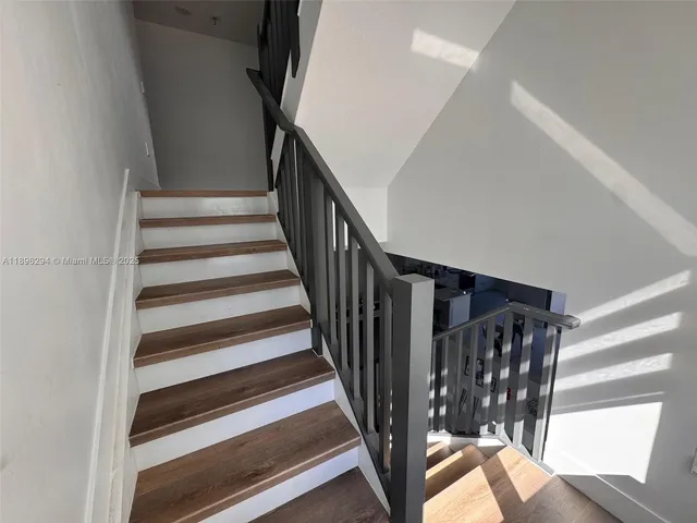 a spacious bathroom with a double vanity sink mirror and toilet