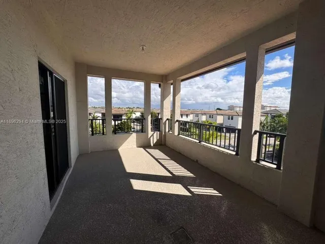 a view of staircase with white walls