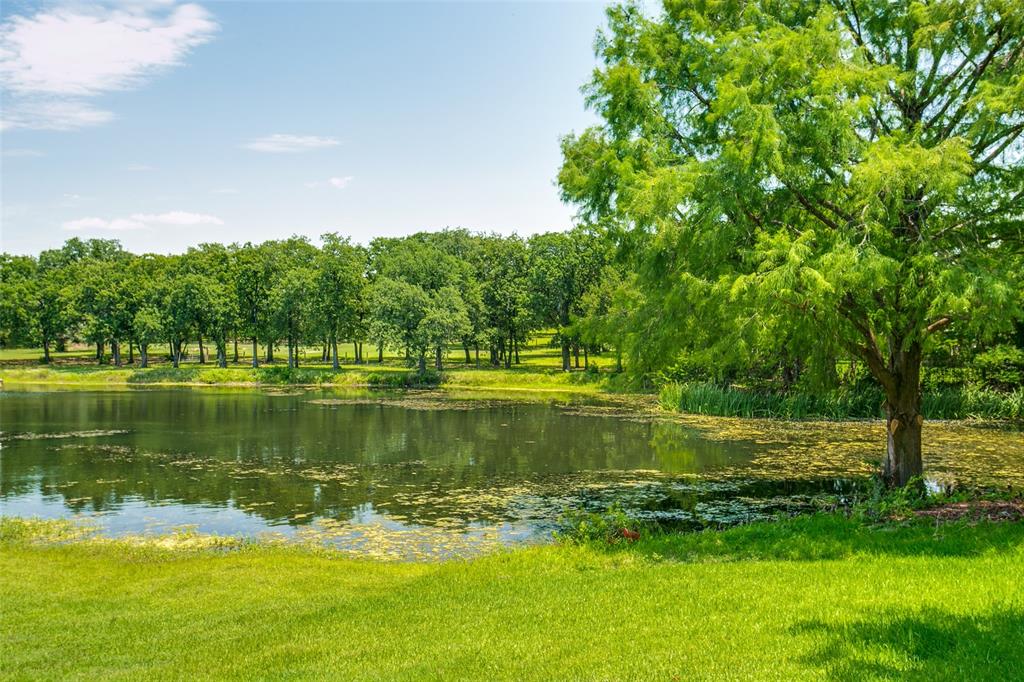 a view of a lake with a big yard