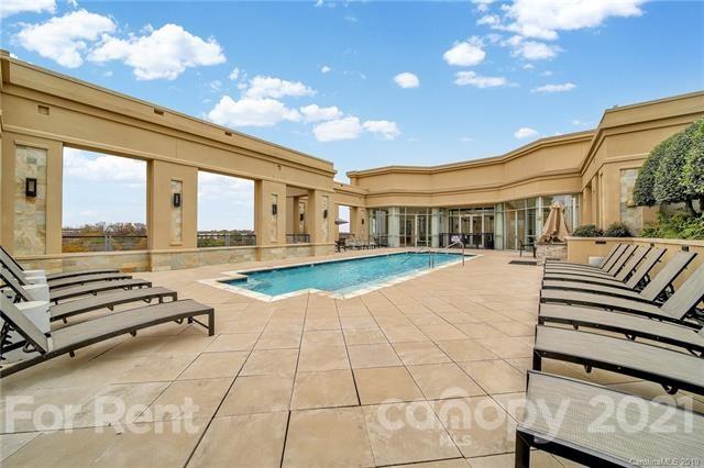 4300 Sharon Road, Unit 531 Charlotte, NC 28211 - Photo 4 of 10 a view of a patio with a tv