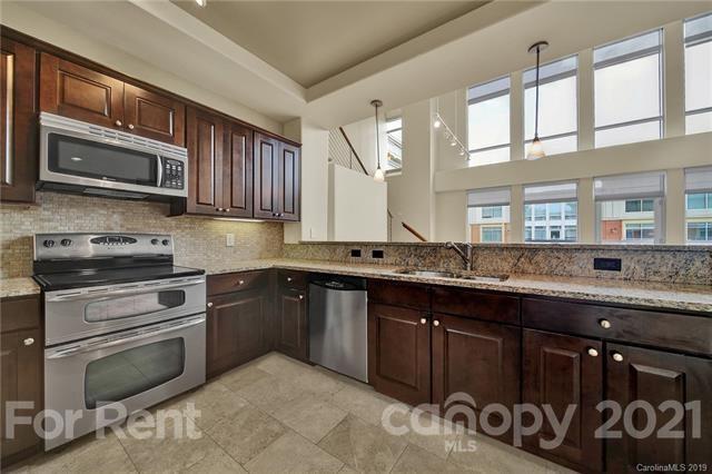 4300 Sharon Road, Unit 531 Charlotte, NC 28211 - Photo 7 of 10 a kitchen with a sink stove and microwave