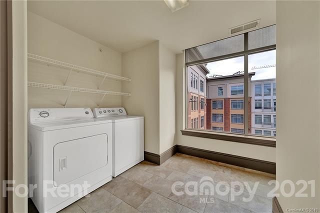 4300 Sharon Road, Unit 531 Charlotte, NC 28211 - Photo 8 of 10 a utility room with dryer and washer