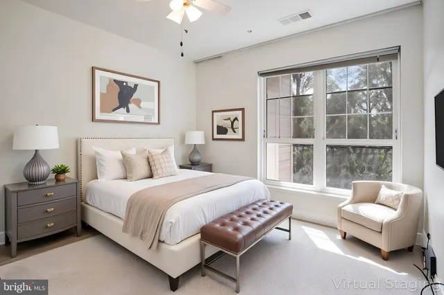 a bedroom with a bed and a couch