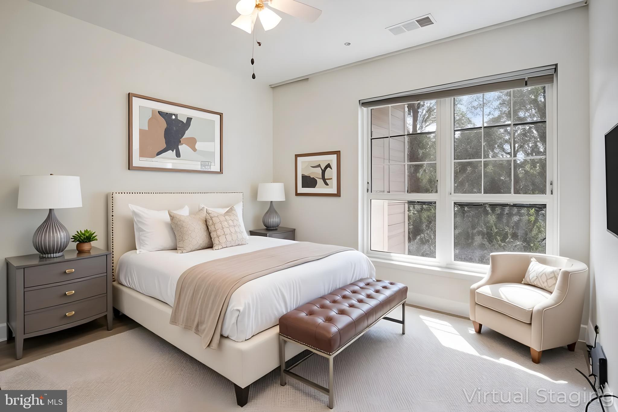 1530 Spring Gate Dr., Unit 9308 McLean, VA 22102 - Photo 13 of 38 a bedroom with a bed and a couch