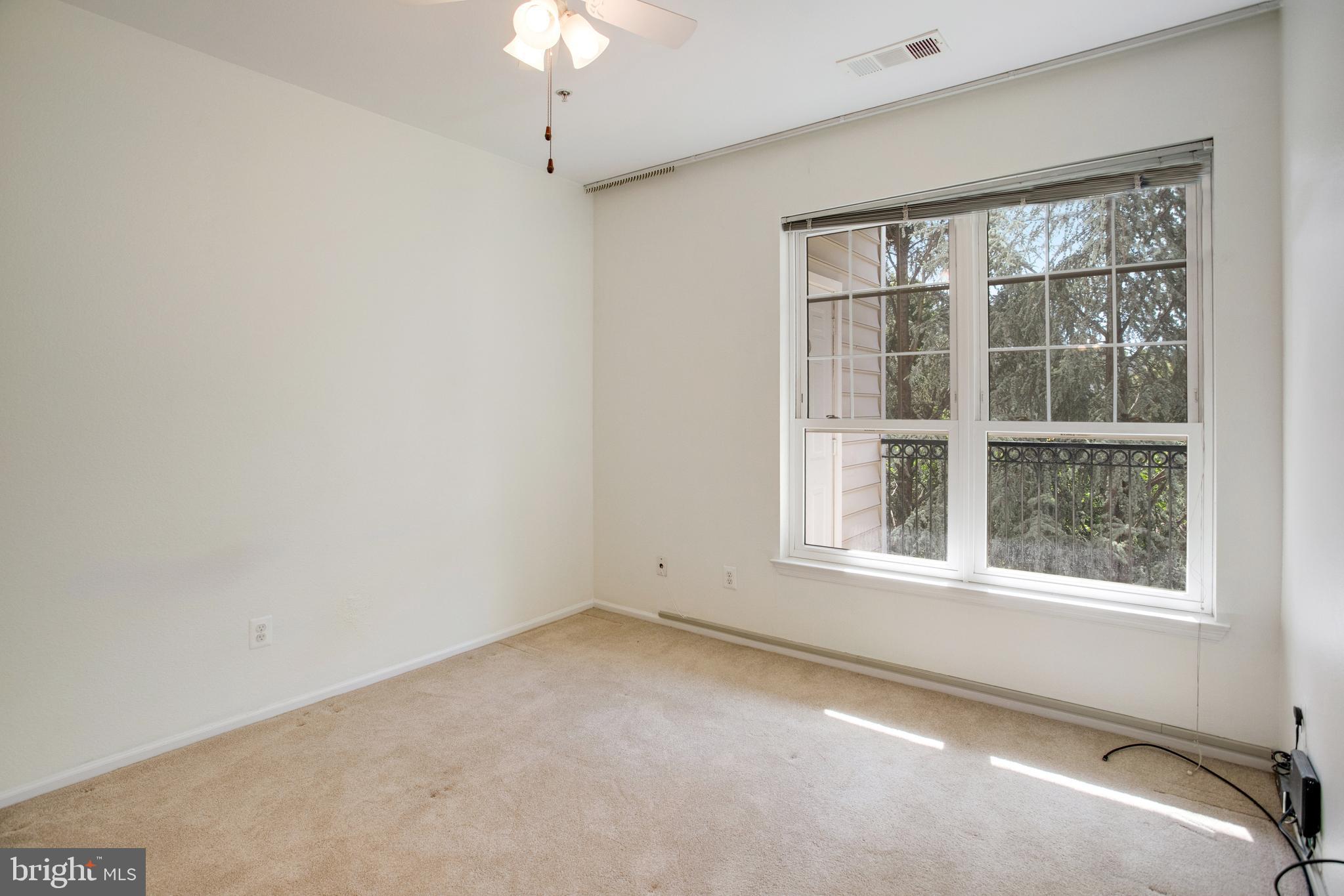 1530 Spring Gate Dr., Unit 9308 McLean, VA 22102 - Photo 14 of 38 an empty room with a window