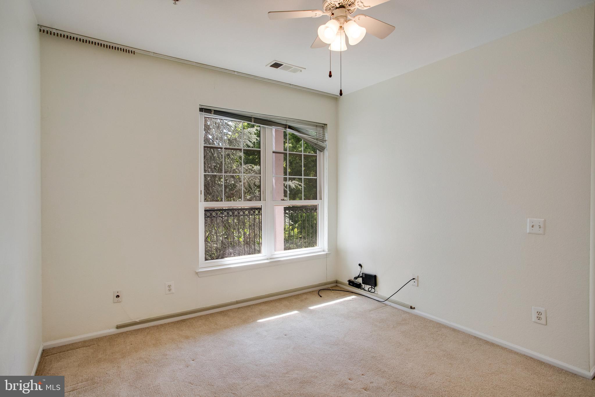 1530 Spring Gate Dr., Unit 9308 McLean, VA 22102 - Photo 16 of 38 an empty room with a window