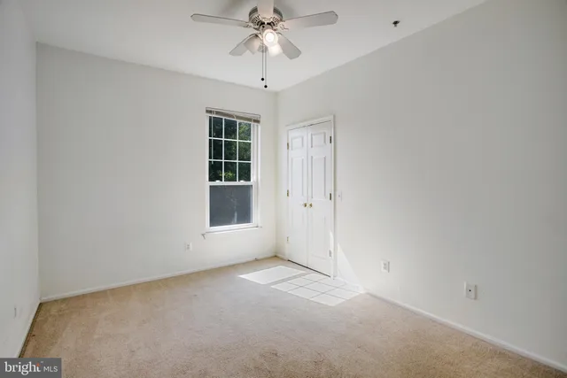 a view of livingroom with hardwood floor and a ceiling fan