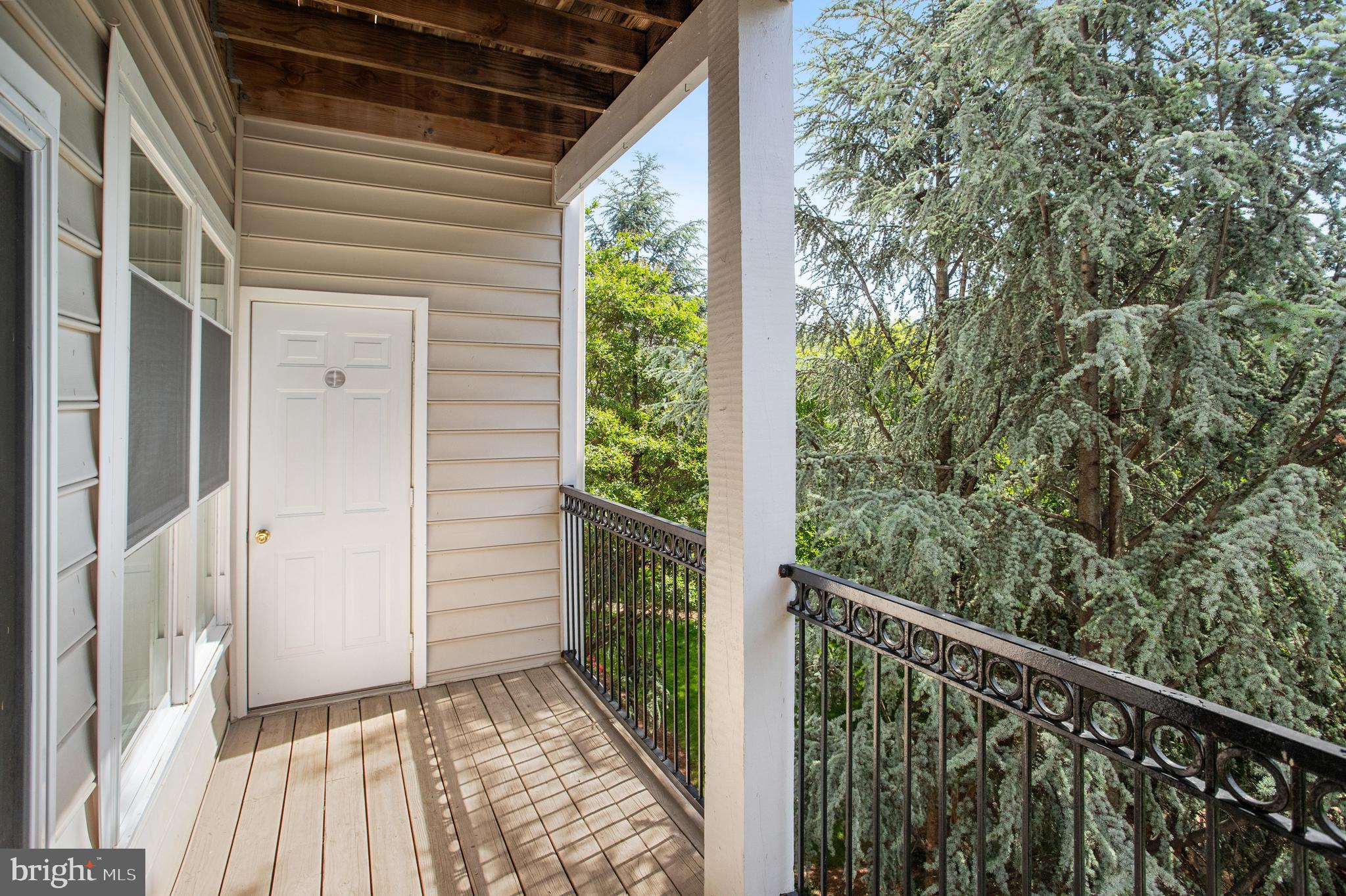 1530 Spring Gate Dr., Unit 9308 McLean, VA 22102 - Photo 30 of 38 a view of a balcony with wooden floor