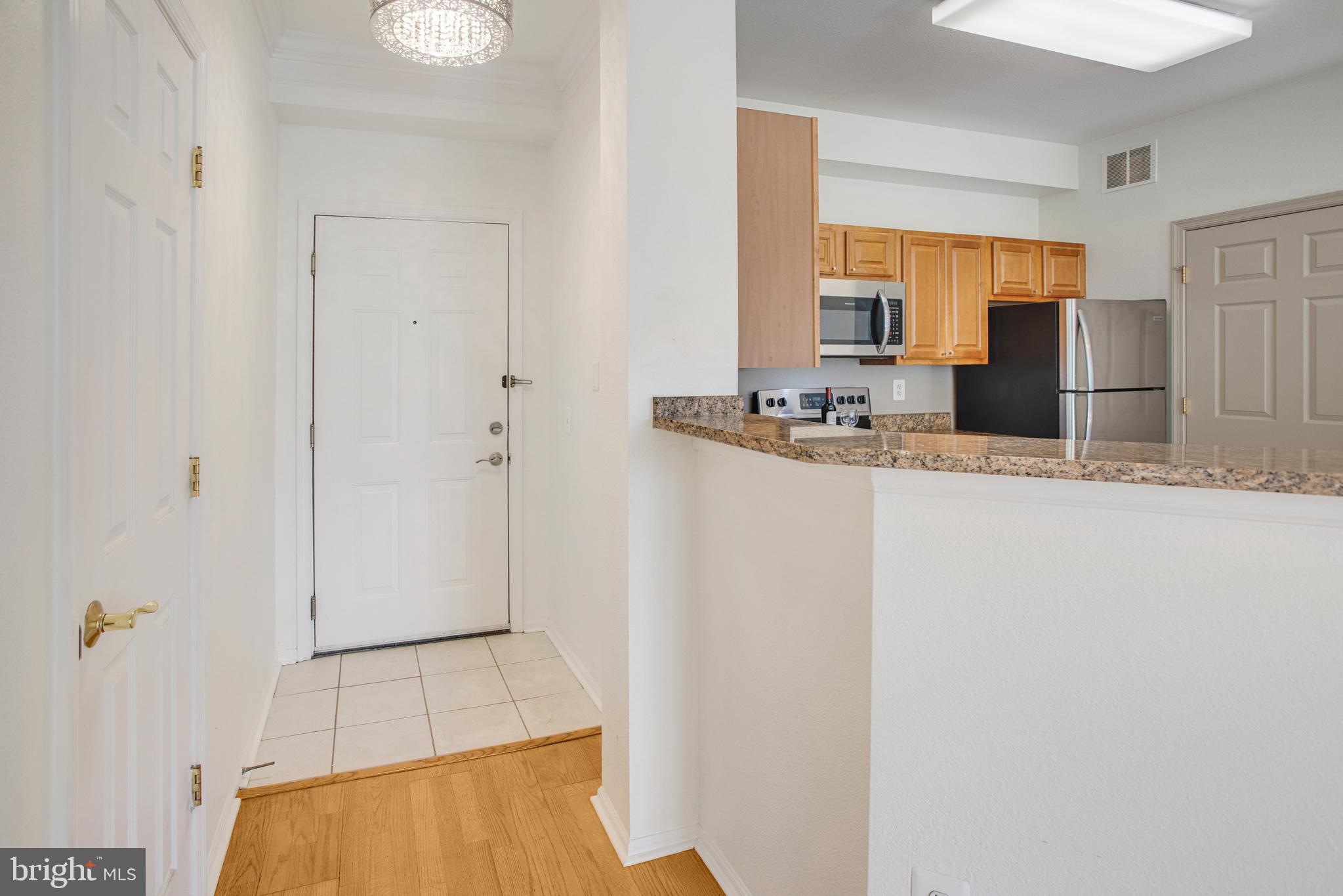 1530 Spring Gate Dr., Unit 9308 McLean, VA 22102 - Photo 3 of 38 a bathroom with a sink and a mirror