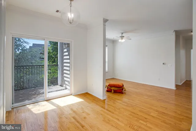 a room with a window and wooden floor