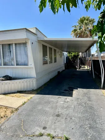 a view of a patio with a table and chairs