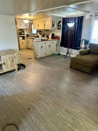 a living room with furniture and a mirror