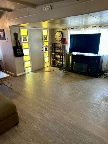 a view of a livingroom with furniture and a fireplace