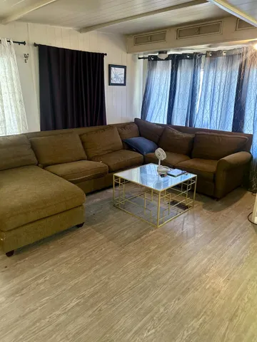 a living room with a couch and a dresser