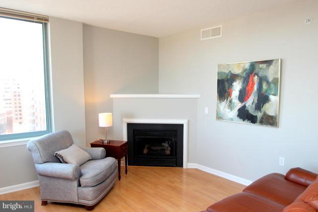 851 North Glebe Road, Unit 1311 Arlington, VA 22203 - Photo 1 of 30 a living room with furniture and a fireplace
