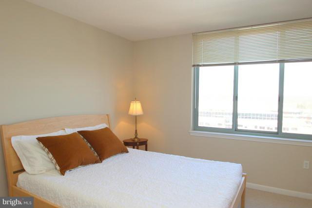 851 North Glebe Road, Unit 1311 Arlington, VA 22203 - Photo 12 of 30 a bedroom with a bed and a window
