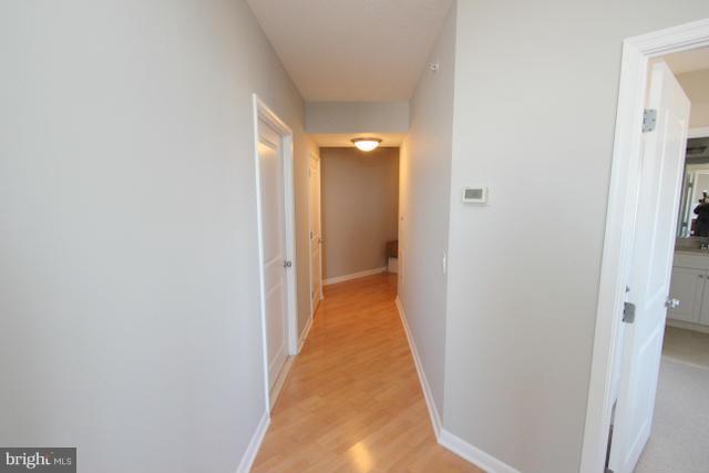 851 North Glebe Road, Unit 1311 Arlington, VA 22203 - Photo 16 of 30 a view of a hallway with a white walls