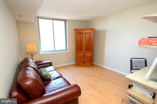 851 North Glebe Road, Unit 1311 Arlington, VA 22203 - Photo 17 of 30 a bedroom with a bed and window