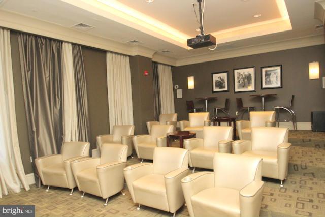 851 North Glebe Road, Unit 1311 Arlington, VA 22203 - Photo 24 of 30 a living room with furniture and a chandelier
