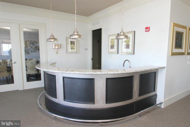 851 North Glebe Road, Unit 1311 Arlington, VA 22203 - Photo 26 of 30 a view with granite countertop a sink and a mirror