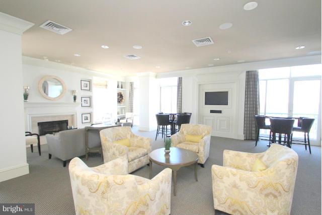851 North Glebe Road, Unit 1311 Arlington, VA 22203 - Photo 27 of 30 a living room with fireplace furniture and a large window