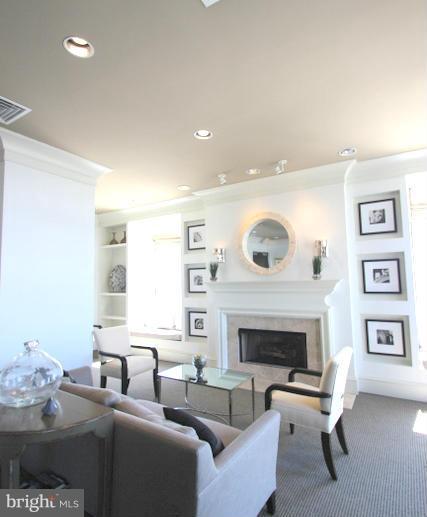 851 North Glebe Road, Unit 1311 Arlington, VA 22203 - Photo 28 of 30 a living room with furniture and a fireplace