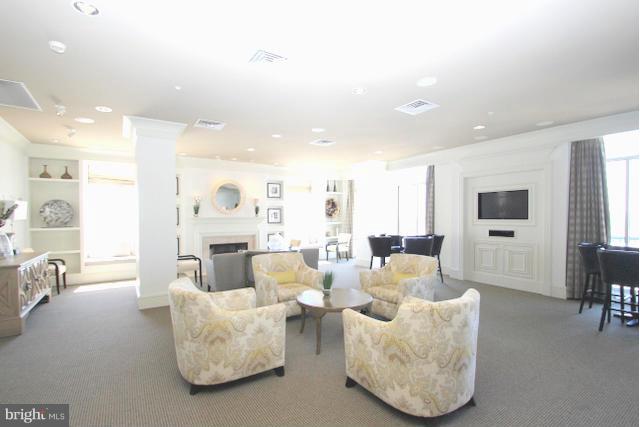 851 North Glebe Road, Unit 1311 Arlington, VA 22203 - Photo 29 of 30 a living room with furniture and a flat screen tv