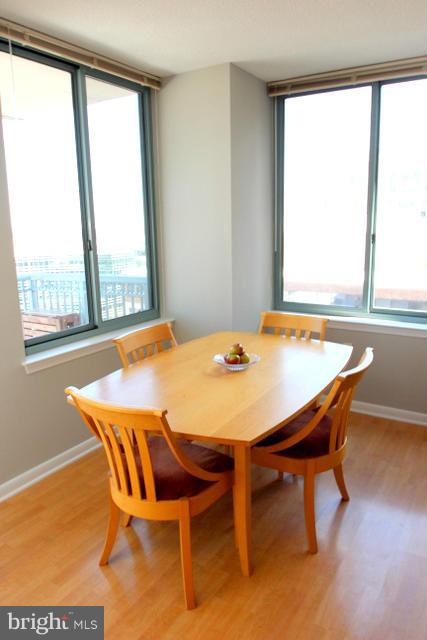 851 North Glebe Road, Unit 1311 Arlington, VA 22203 - Photo 6 of 30 a dining room with furniture and window