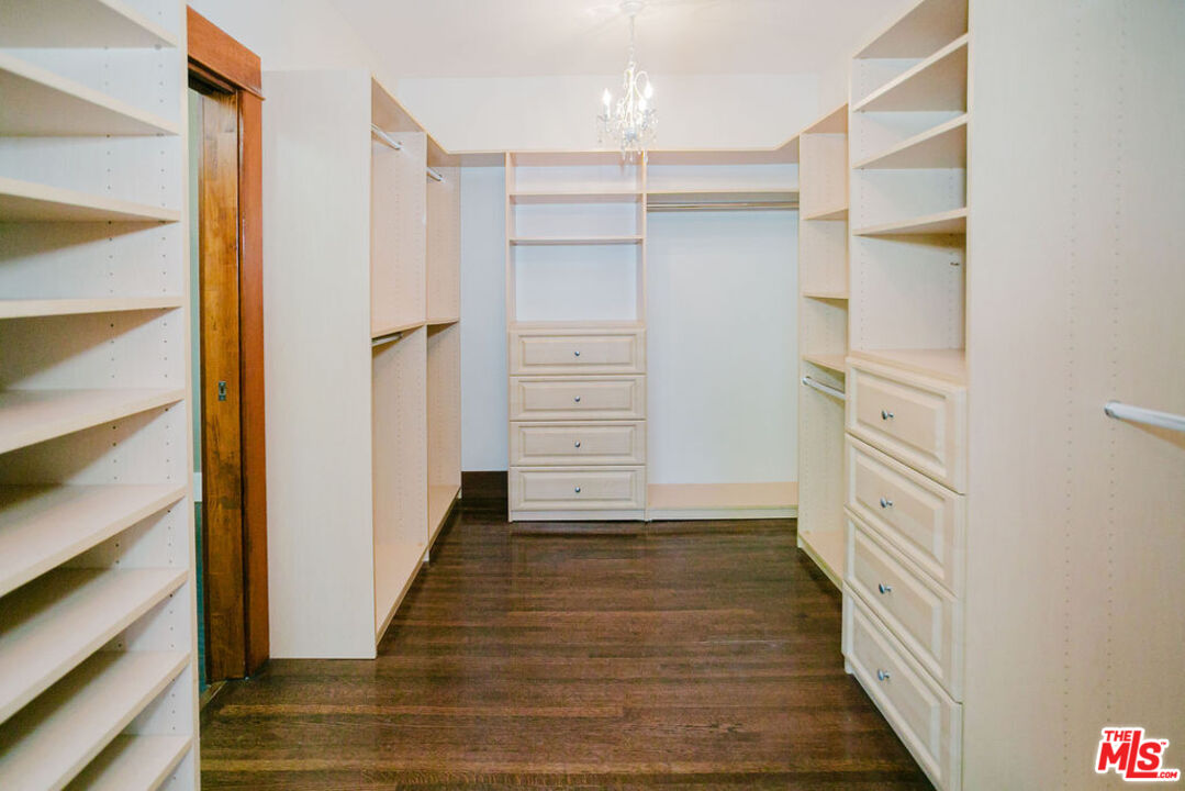 13239 Addison Street Sherman Oaks, CA 91423 - Photo 28 of 29 a view of walk in closet with empty racks