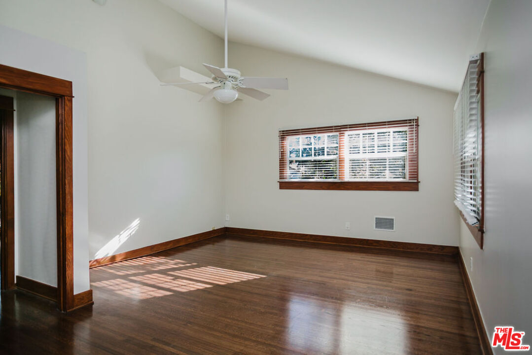 13239 Addison Street Sherman Oaks, CA 91423 - Photo 29 of 29 a view of empty room with wooden floor and fan