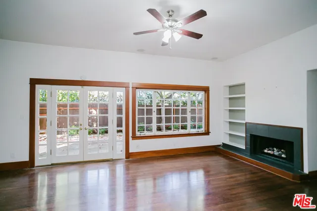 a view of a dining room with furniture and a fireplace