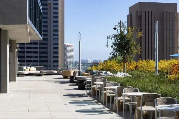 a view of swimming pool with outdoor seating and city view