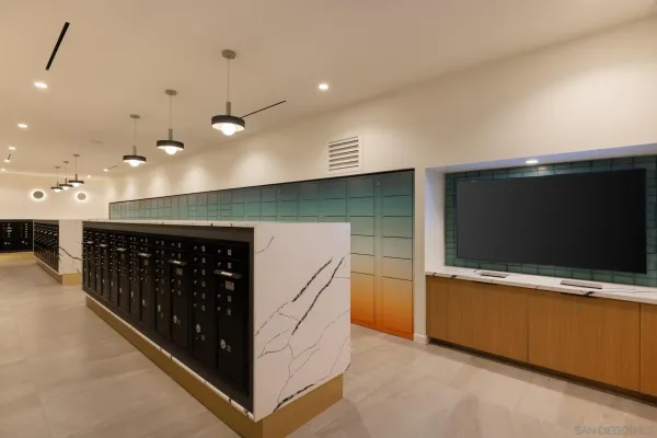 a kitchen with stainless steel appliances kitchen island granite countertop a refrigerator and a microwave