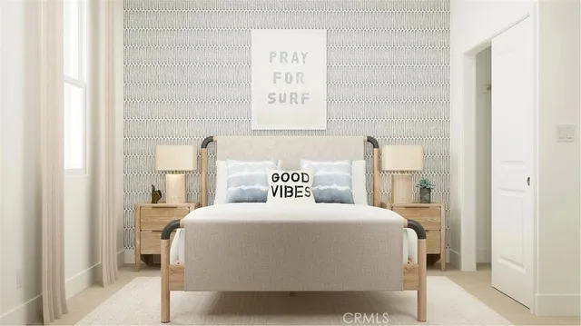 a bedroom with a bed and a painting on the wall