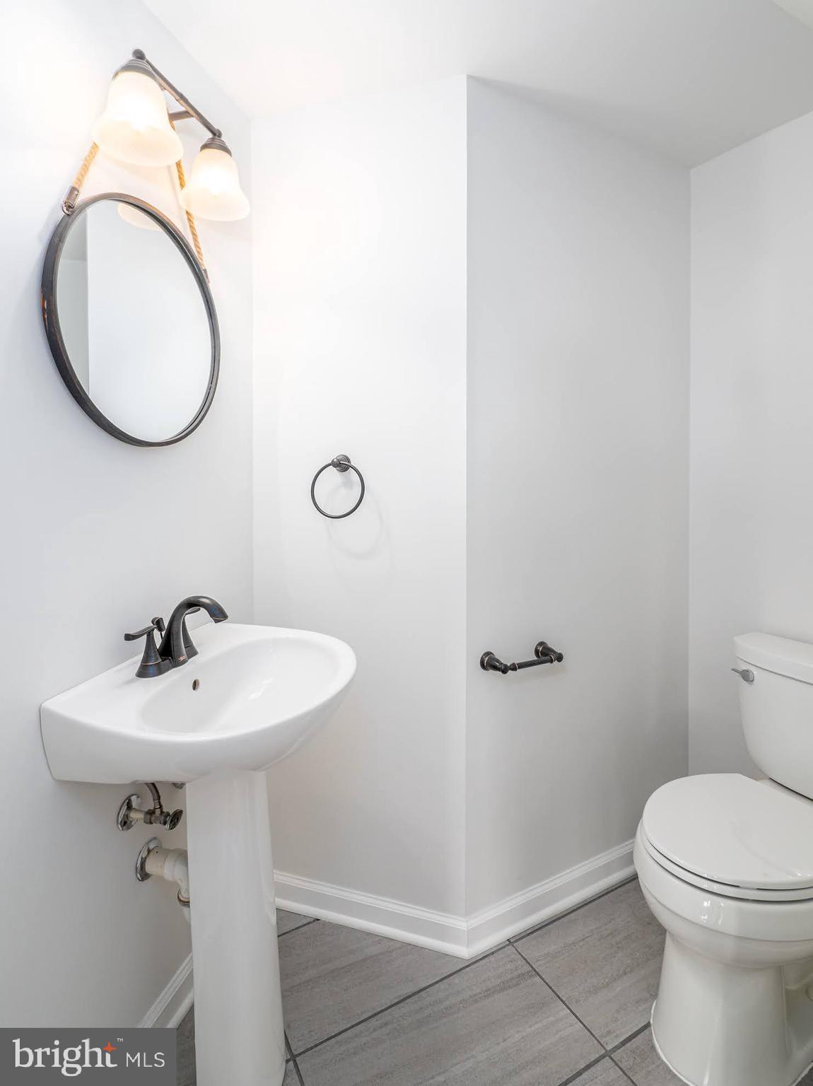 12755 Fair Crest Court, Unit 301 Fairfax, VA 22033 - Photo 11 of 24 a bathroom with a sink mirror and toilet