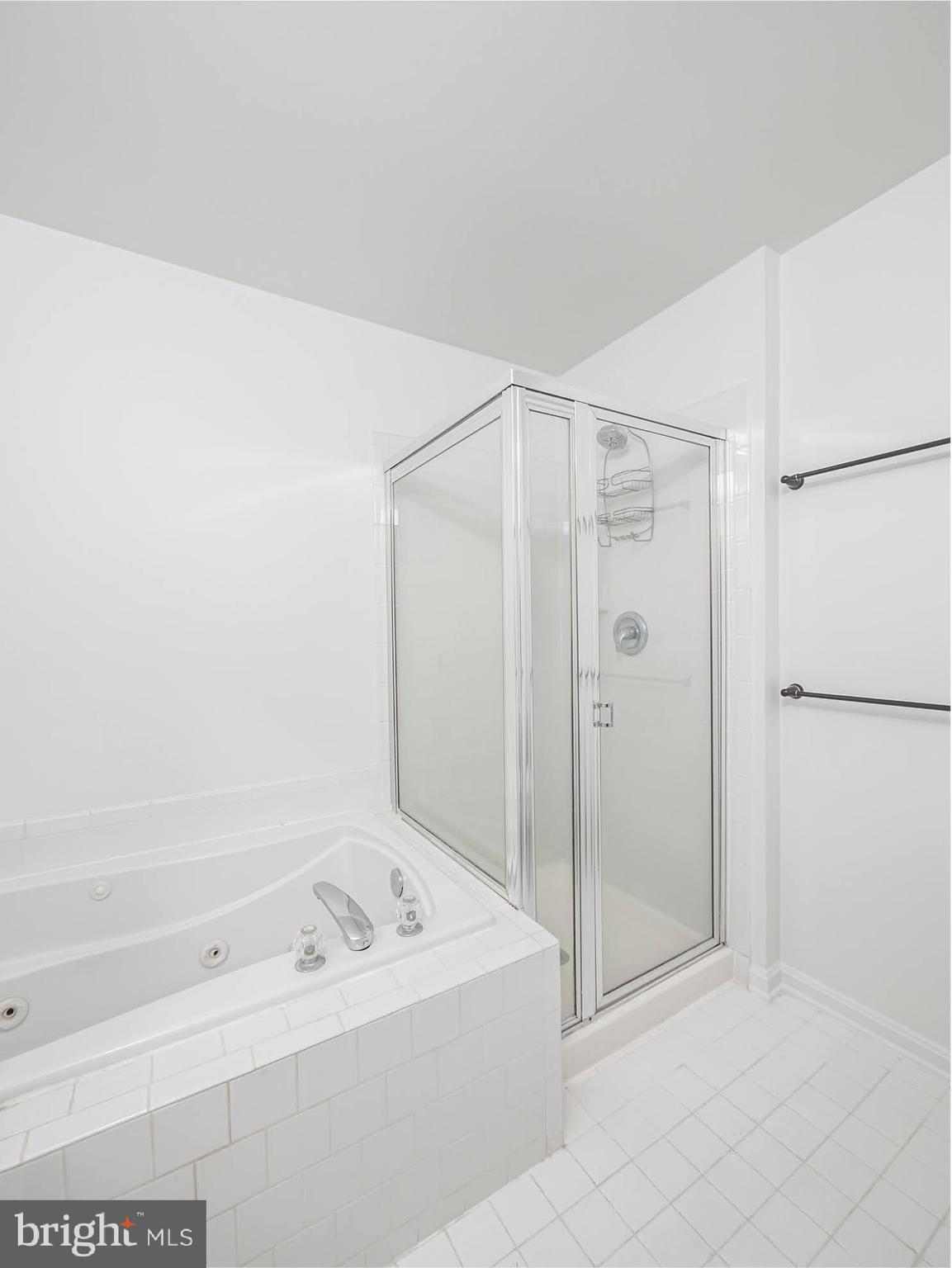 12755 Fair Crest Court, Unit 301 Fairfax, VA 22033 - Photo 16 of 24 a bathroom with a bathtub and a shower