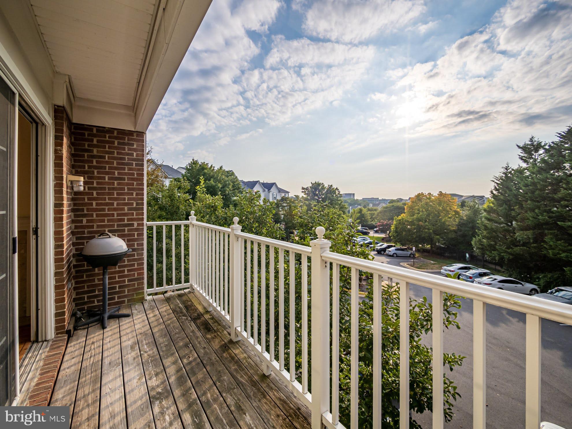 12755 Fair Crest Court, Unit 301 Fairfax, VA 22033 - Photo 23 of 24 a view of balcony with wooden floor and fence