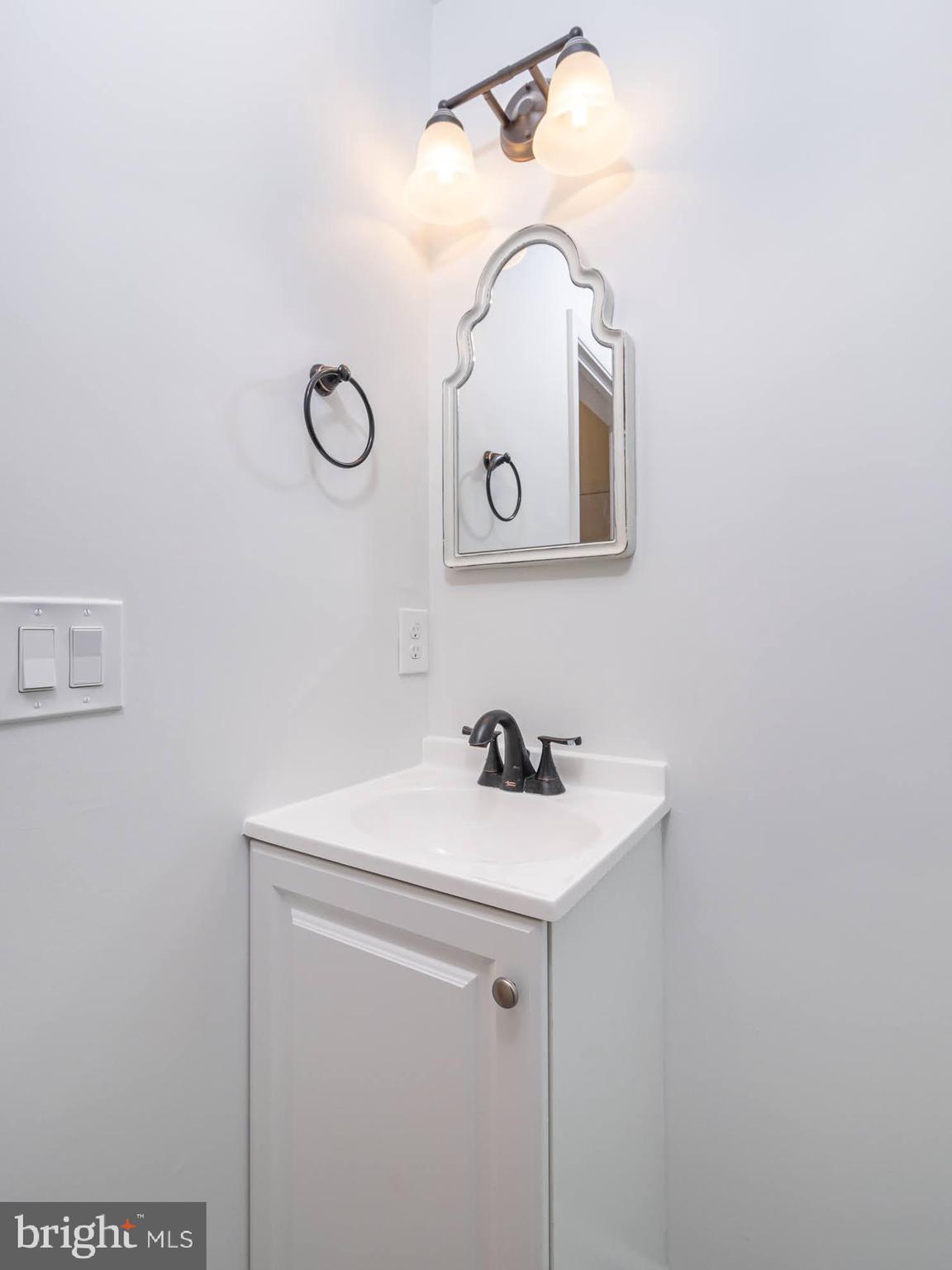 12755 Fair Crest Court, Unit 301 Fairfax, VA 22033 - Photo 9 of 24 a bathroom with a sink and a mirror
