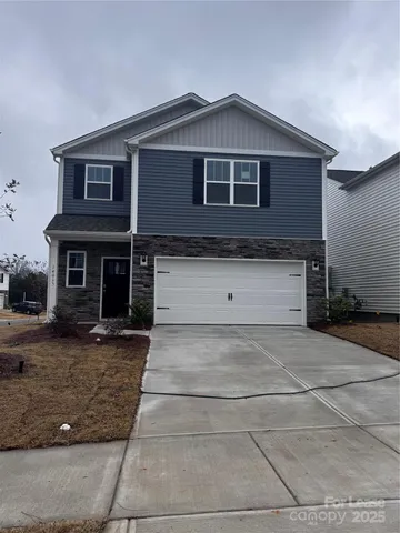 a front view of a house with yard