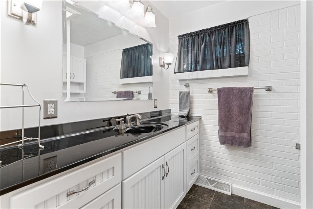 412 Holyoke Road Butler, PA 16001 - Photo 11 of 29 a kitchen with stainless steel appliances a sink dishwasher stove and cabinets