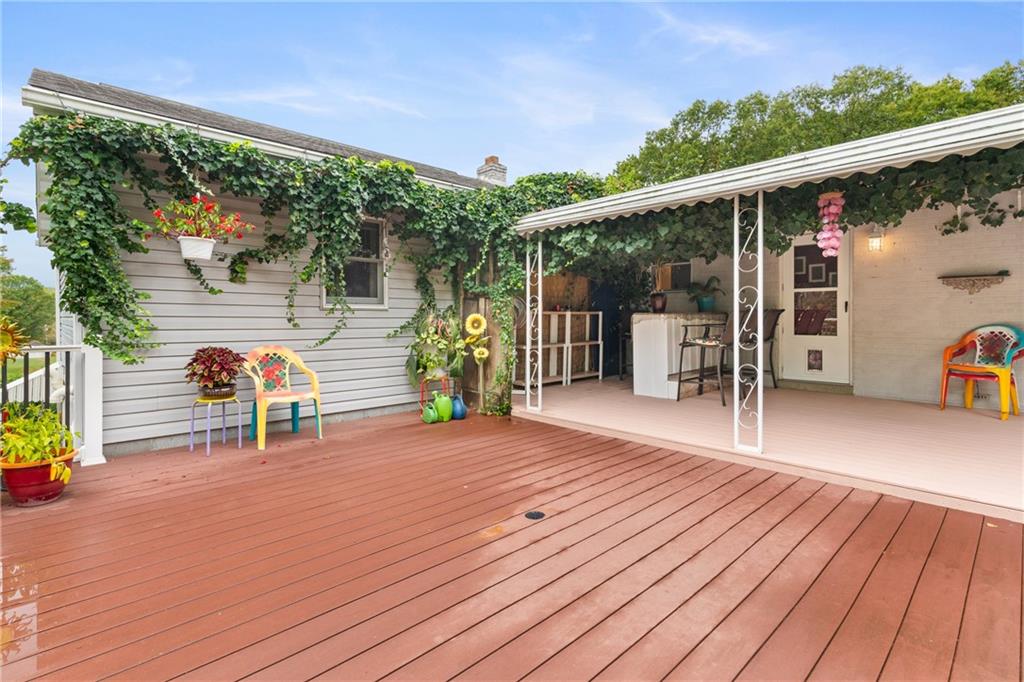 412 Holyoke Road Butler, PA 16001 - Photo 22 of 29 a view of a deck with wooden floor and outdoor seating