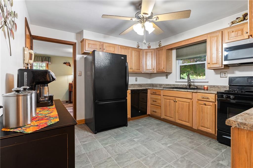 412 Holyoke Road Butler, PA 16001 - Photo 3 of 29 a kitchen with a refrigerator a sink and a stove