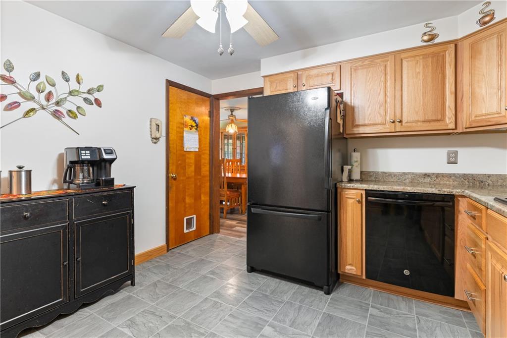 412 Holyoke Road Butler, PA 16001 - Photo 4 of 29 a kitchen with stainless steel appliances granite countertop a refrigerator a stove and a sink