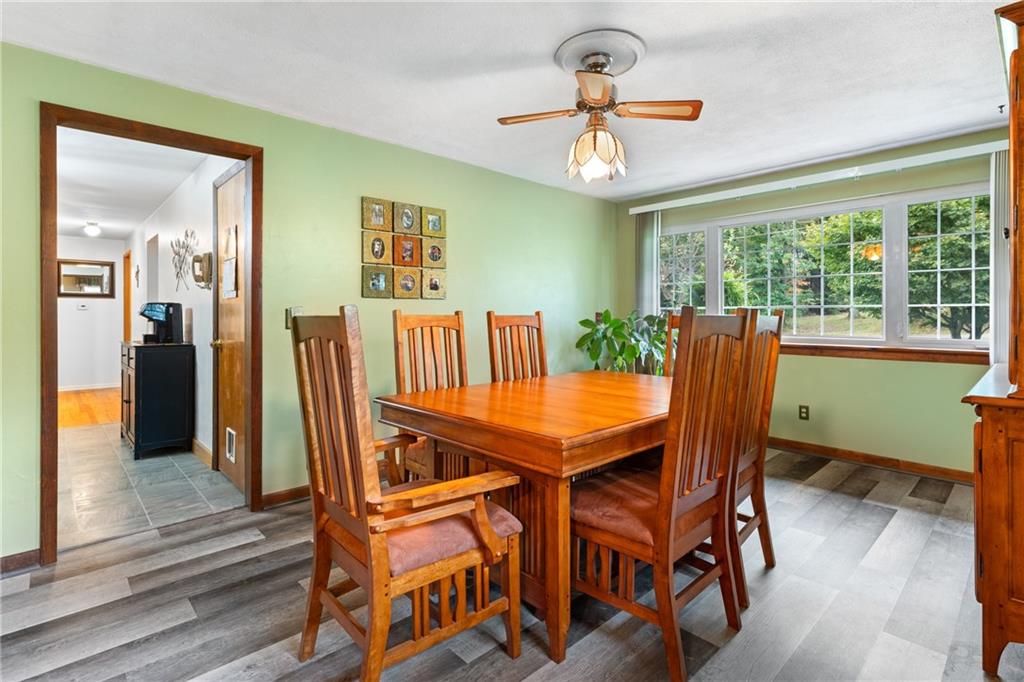 412 Holyoke Road Butler, PA 16001 - Photo 8 of 29 a view of a dining room with furniture window and wooden floor