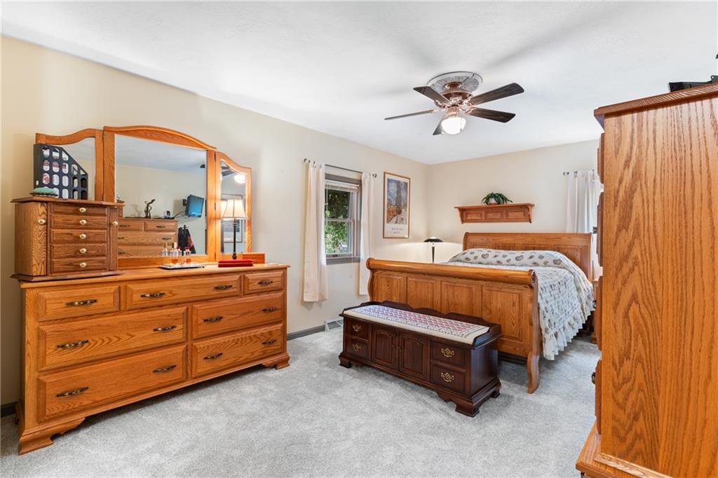 412 Holyoke Road Butler, PA 16001 - Photo 9 of 29 a bed room with a bed and a dresser