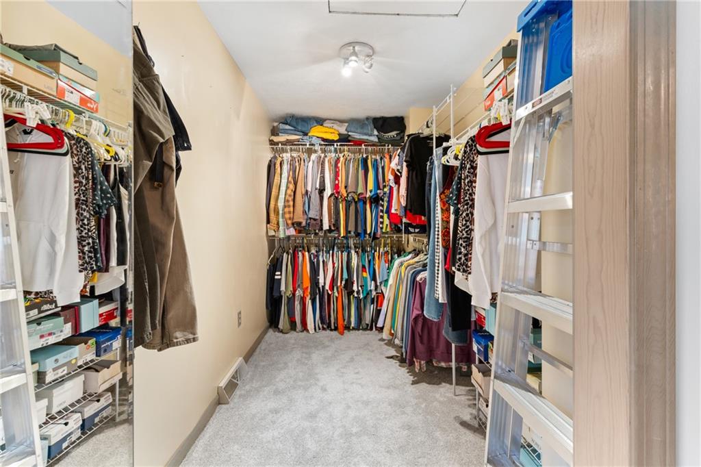 412 Holyoke Road Butler, PA 16001 - Photo 10 of 29 a view of walk in closet with clothes