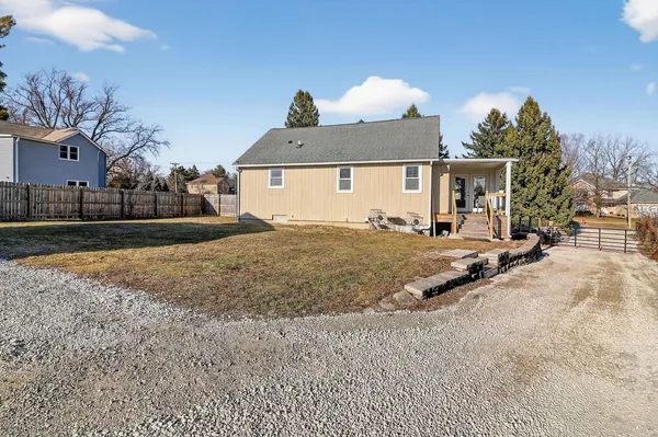 a view of a house with a yard and garage