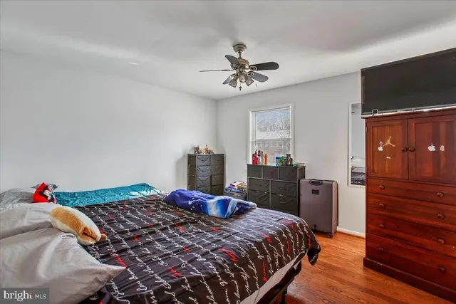 a bedroom with a bed and a dresser